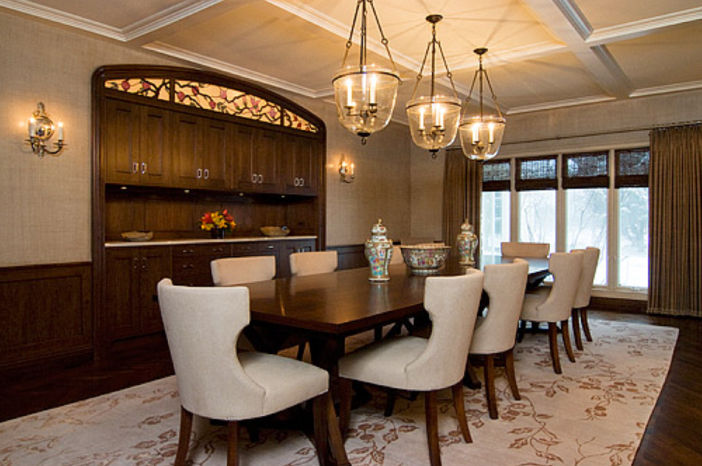 Formal dining room with dark wood finishes.